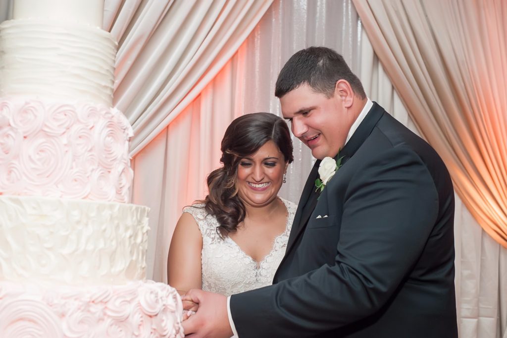 pink wedding cake cutting